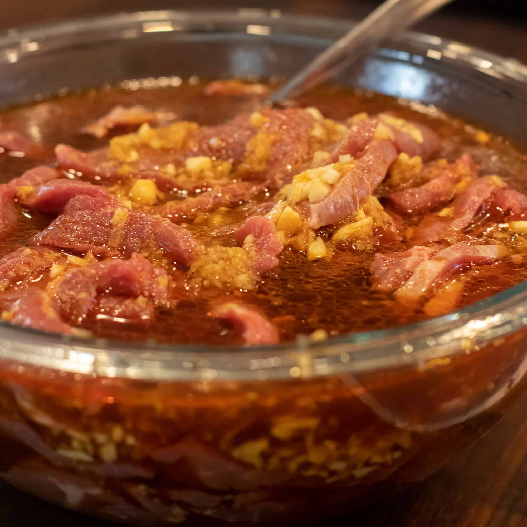 Let the meat marinate in a bowl in the fridge.