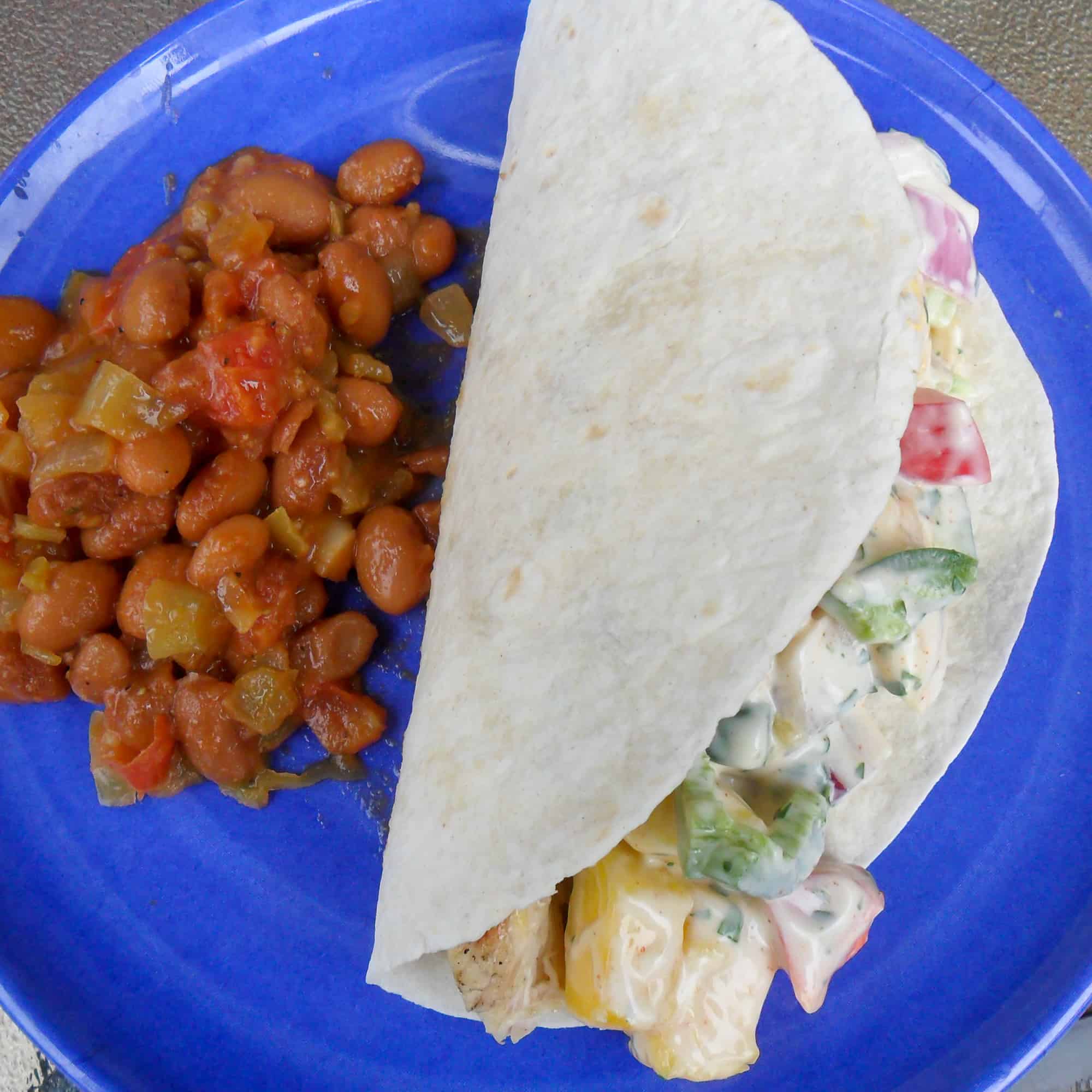 Grilled chicken tacos with mango cilantro ranch dressing is a fresh take on a mexican tex-mex classic dish.