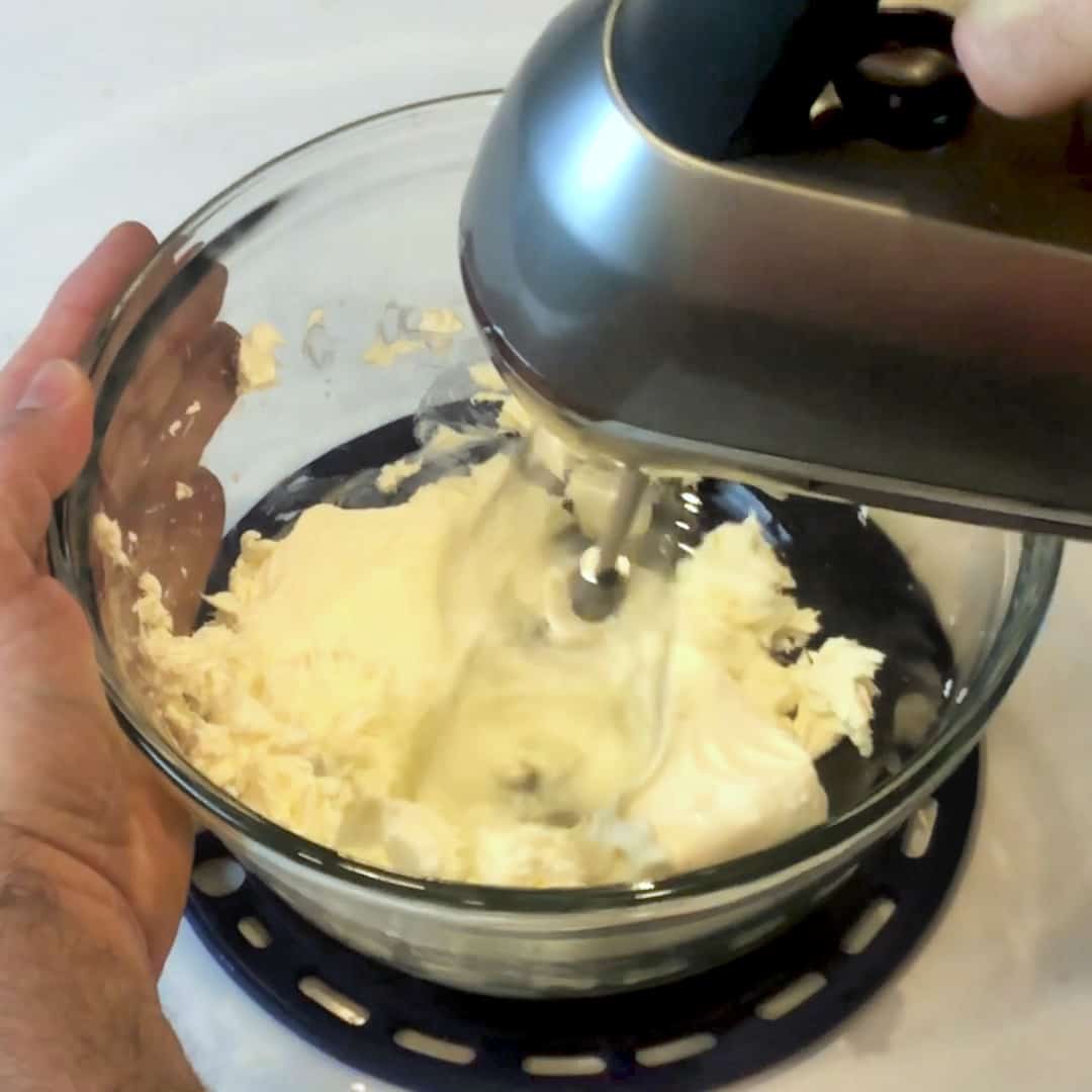 Use a mixer to blend the cream cheese until smooth.