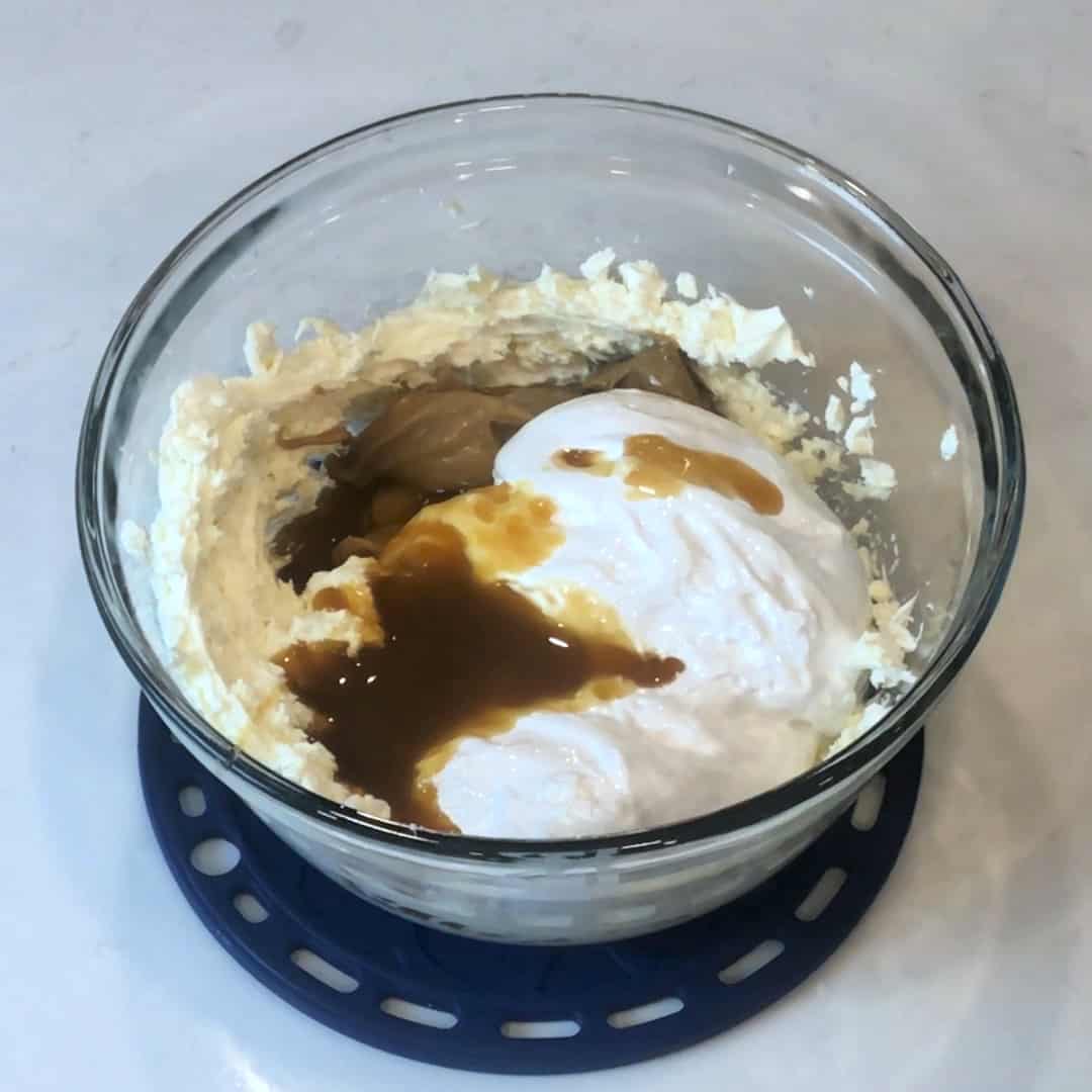 Add peanut butter, marshmallow cream and caramel sauce to the cream cheese.