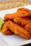 Restaurant style buffalo chicken wings made at home. Easy to prepare wings recipe with a traditional hot and spicy sauce using Frank's or other hot sauce. Great deep fried tail gate party snack.