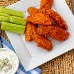 Restaurant style buffalo chicken wings made at home. Easy to prepare wings with a traditional hot and spicy sauce. Great deep fried tail gate party snack.