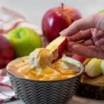 Creamy dip recipe for apples, bananas, other fruit or cookies, made of marshmallow fluff, cream cheese, peanut butter and caramel sauce ice cream topping.