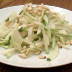 A fresh salad made with fennel, pear and pine nut salad with an orange and honey vinaigrette dressing.