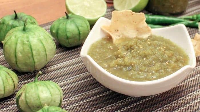 A spicy green salsa recipe made with tomatillos, cilantro, jalapeno or serrano peppers and lime juice. Great with nacho chips, enchiladas, taco, burritos and more!