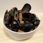 Mussels with a Thai red curry sauce. Rich, spicy and even a little sweet with fresh Thai basil and cilantro. Best served with a side of rice or crusty bread.