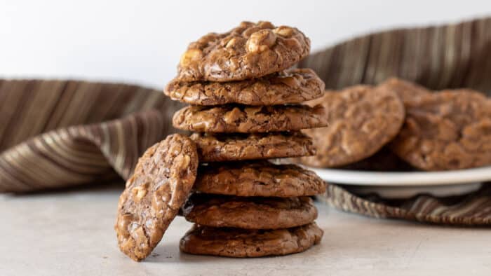 A tall stack of chewy and fudge cookies.