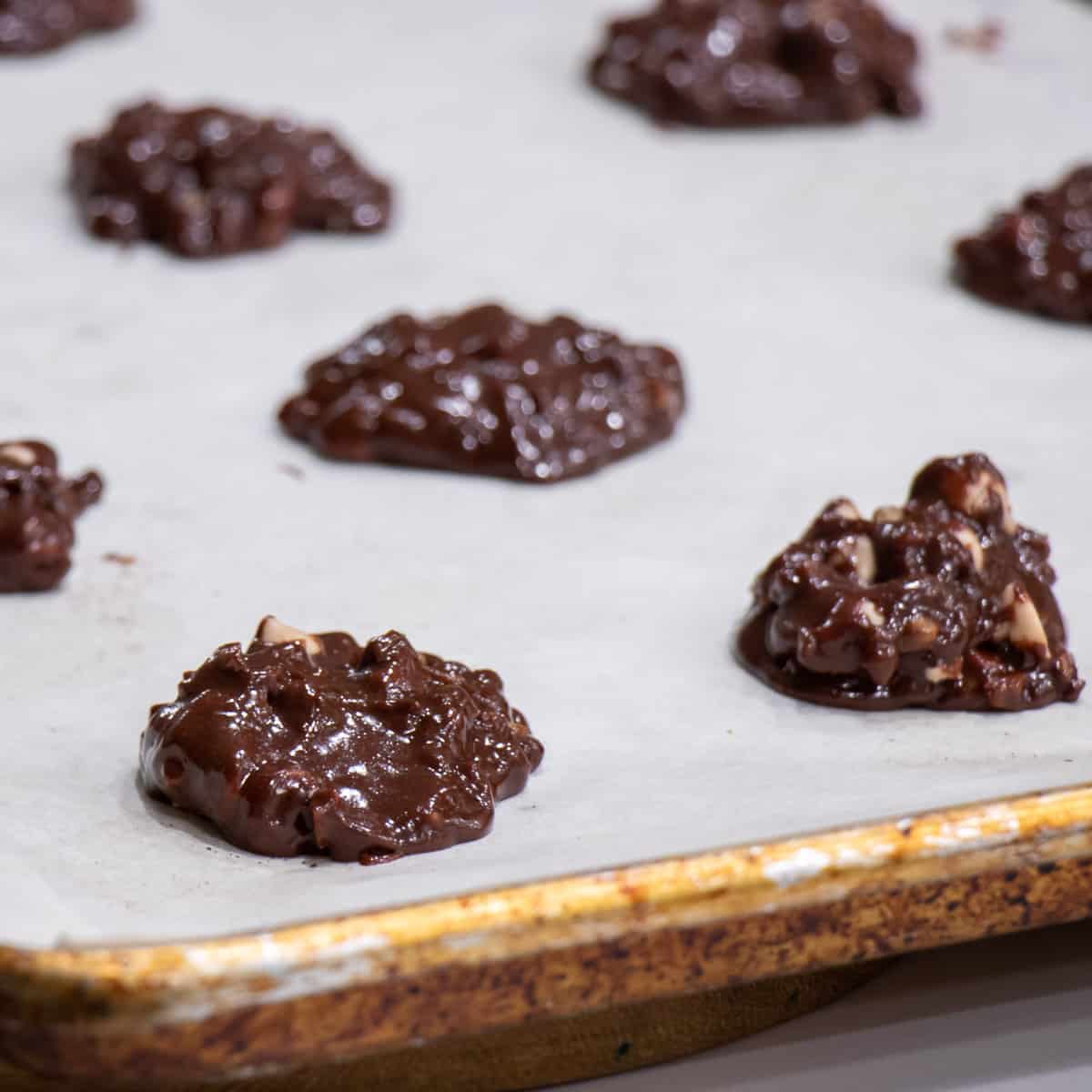 A tray full of dropping cookies ready to go in the oven.