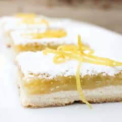 The shortbread base is the perfect crust and the tangy yet sweet lemon filling is to-die-for. As it bakes a thin crispy layer if formed on top of the filling.