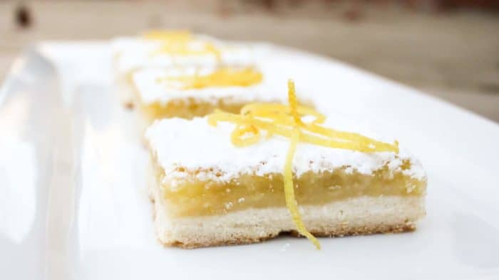The shortbread base is the perfect crust and the tangy yet sweet lemon filling is to-die-for. As it bakes a thin crispy layer if formed on top of the filling.
