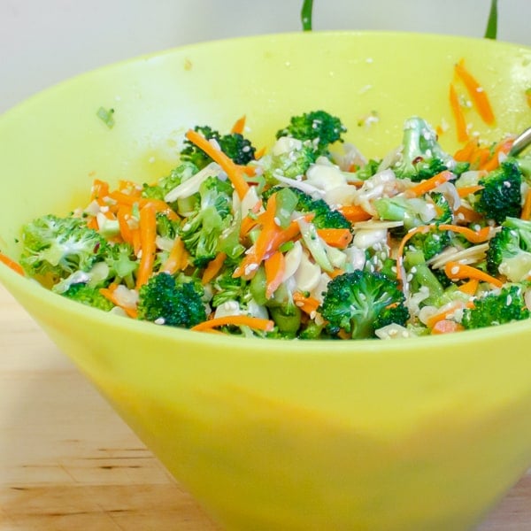 A fresh, crisp salad recipe with broccoli, carrots and green onions. The Asian dressing is made up of sesame oil, soy sauce, rice vinegar, honey, ginger, garlic and dried chillies.