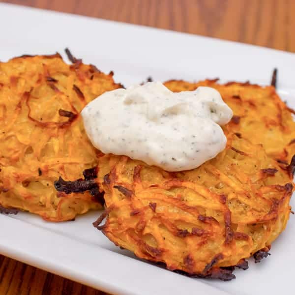 This sweet potato pancake (latkes) recipe has a wonderful combination of sweet and spice. They are baked instead of being fried so they are a healthy option for people celebrating Hanukkah.