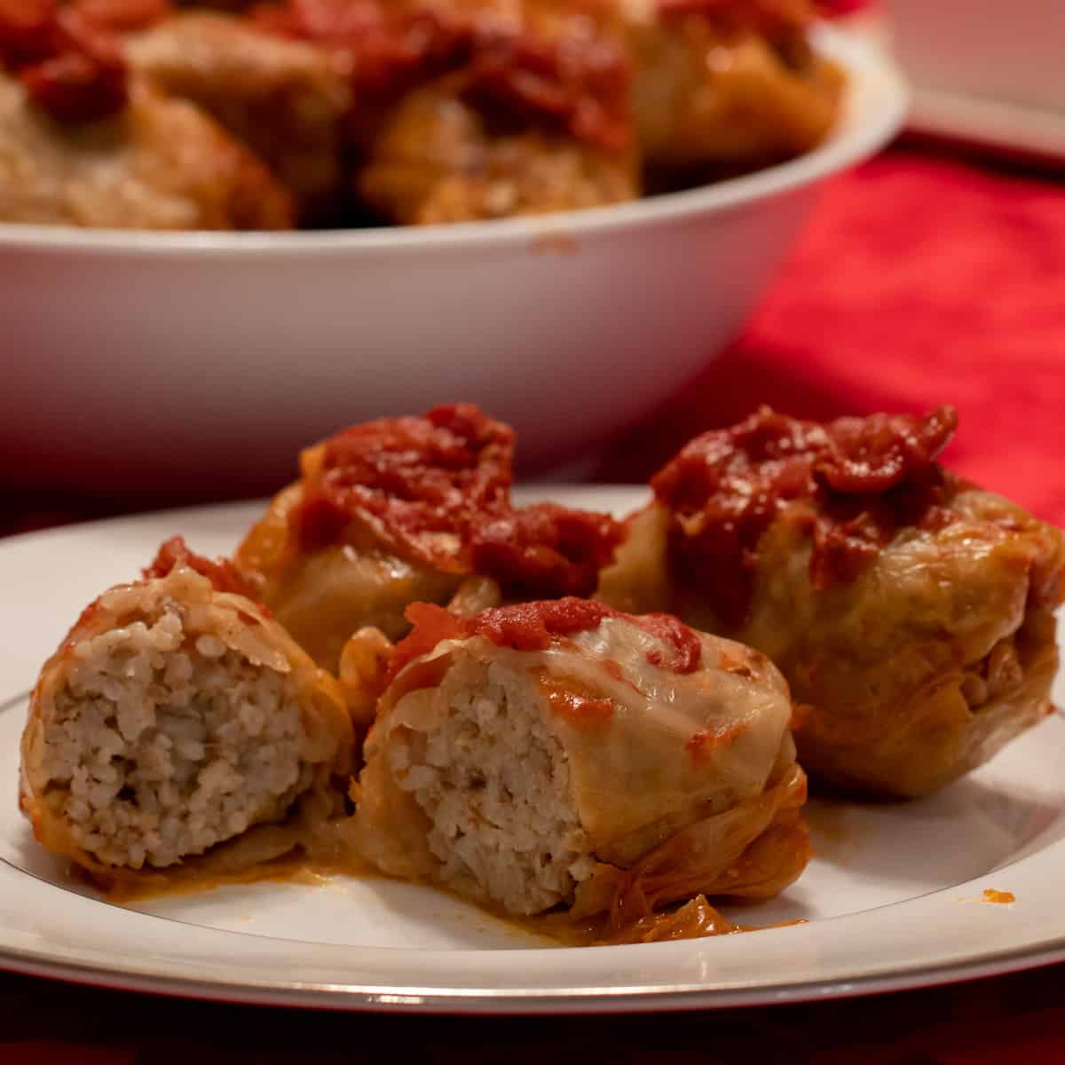 A close up picture of a plate of cabbage rolls.