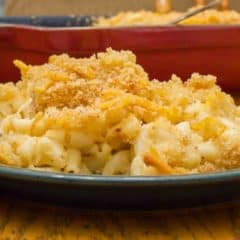 Easy recipe for how to make homemade mac and cheese with a crumble topping. Macaroni pasta noodles with a creamy three cheese sauce of cheddar, mozzarella and parmesan.