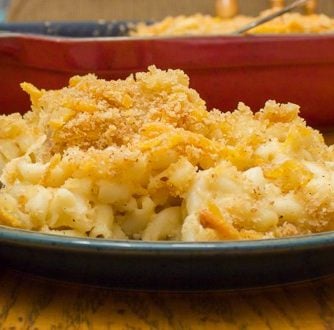 Easy recipe for how to make homemade mac and cheese with a crumble topping. Macaroni pasta noodles with a creamy three cheese sauce of cheddar, mozzarella and parmesan.