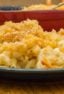 Easy recipe for how to make homemade mac and cheese with a crumble topping. Macaroni pasta noodles with a creamy three cheese sauce of cheddar, mozzarella and parmesan.