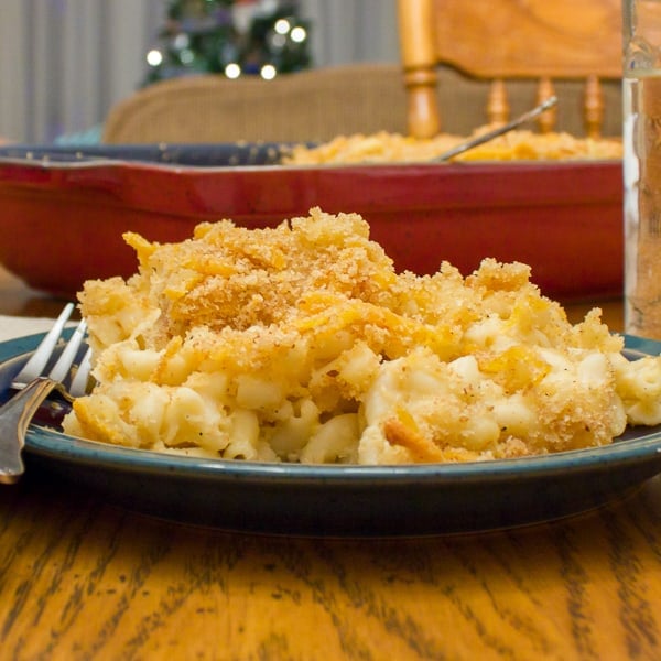 Easy recipe for how to make homemade mac and cheese with a crumble topping. Macaroni pasta noodles with a creamy three cheese sauce of cheddar, mozzarella and parmesan.