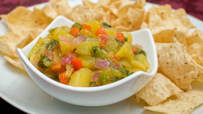 A fresh fruity salsa with a Mexican kick of cumin and jalapeno peppers. This bright peach and mango salsa goes great with nacho chips.