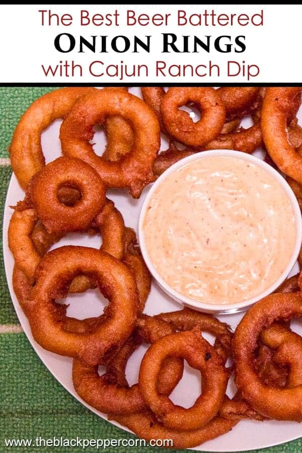 Light and crispy onion rings recipe that are deep fried in a beer batter coating with a cajun dip similar to the kind from Outback Steakhouses Bloomin' Onion.