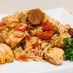 Instructions for how to make jambalaya. This classic Cajun and Creole dish uses chicken and andouille along with onions, celery and peppers and baked with rice.