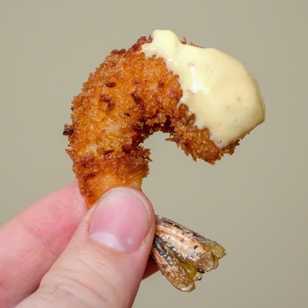 This deep fried shrimp recipe has a crispy breading of panko and coconut. The Thai mayo has tang from lime juice and heat from sriracha sauce and is the perfect dip for these delicious shrimp.