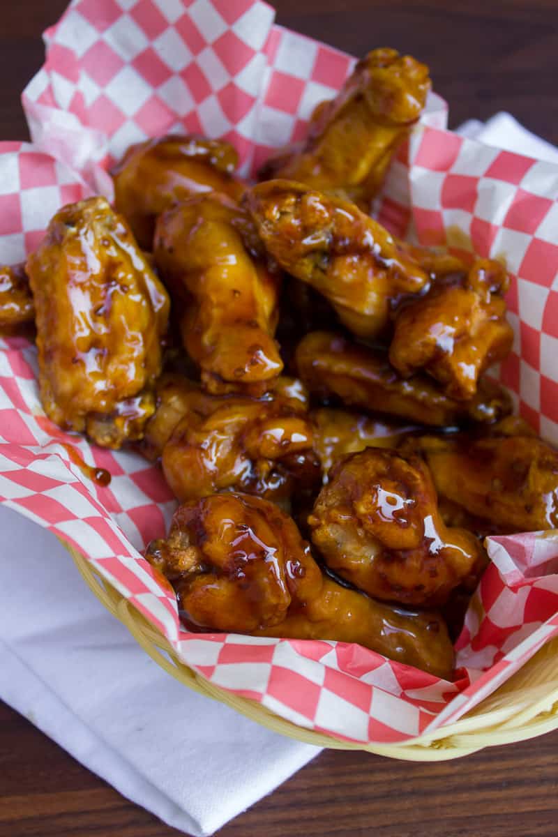An overhead image of a basket of chicken wings.