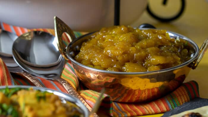 A bowl of mango chutney in an Indian style dish.