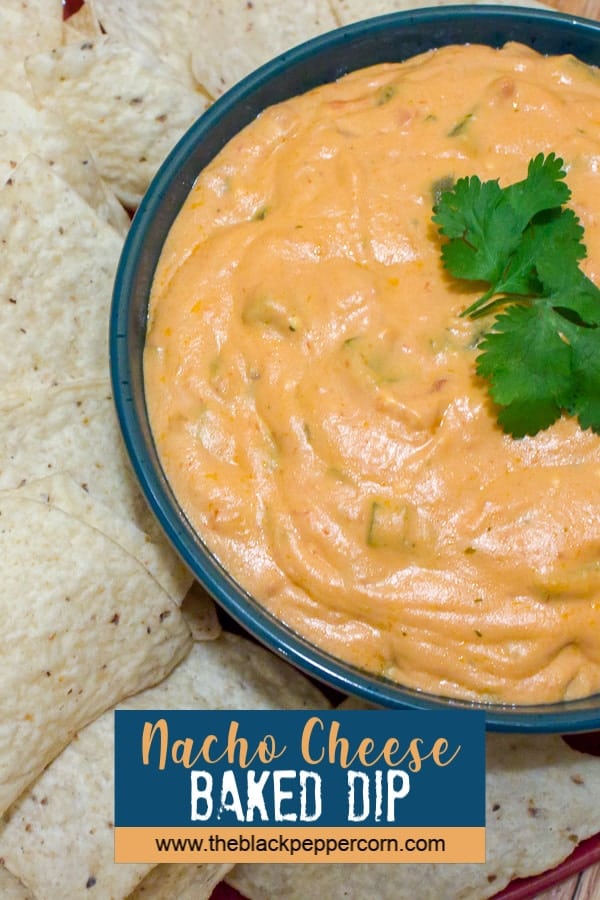 An easy to make hot nacho dip recipe that has only 4 ingredients and baked to a creamy perfection. Served warm, with nacho chips, this dip is the ultimate game day food!