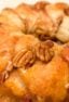 How to make monkey bread recipe with Pillsbury biscuit tubes and then has a caramel mixture that is poured over top and coats the pecans and monkey bread.