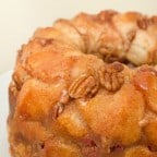 How to make monkey bread recipe with Pillsbury biscuit tubes and then has a caramel mixture that is poured over top and coats the pecans and monkey bread.