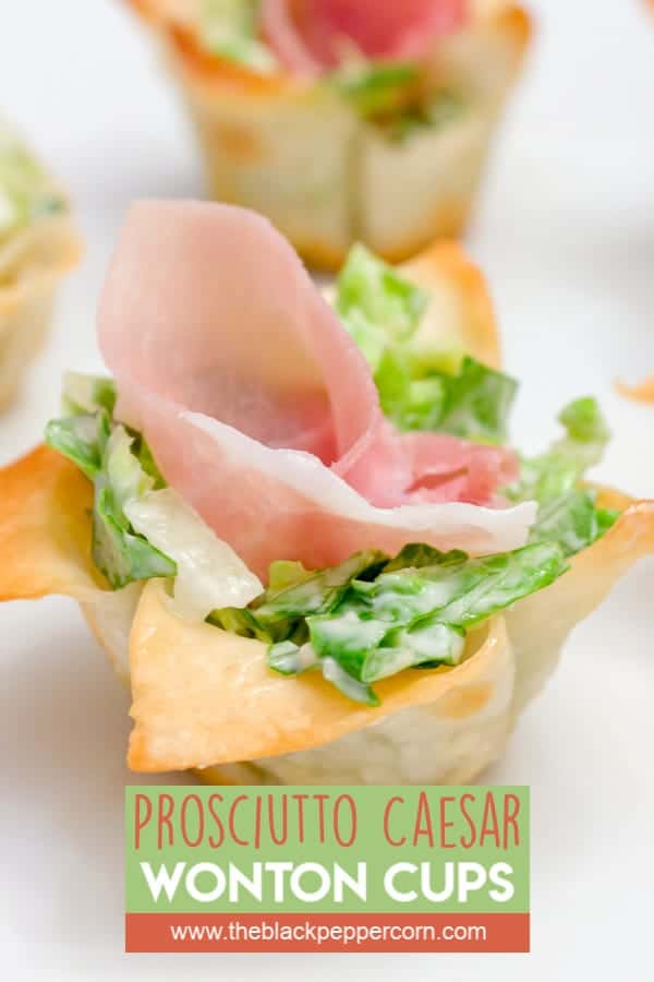 This wonton cup recipe is a snap to make and filled with caesar salad, parmesan cheese and a slice of prosciutto. They look amazing and taste delicious!