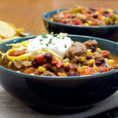 Hearty chili recipe with cubes of steak, black beans and corn. This is serious chili made for people who need a serious meal!