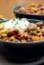 Hearty chili recipe with cubes of steak, black beans and corn. This is serious chili made for people who need a serious meal!