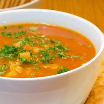 This Manhattan version of clam chowder soup recipe has a tomato broth with potatoes, celery and onions. You can use fresh, canned or frozen clams. The soup is easy to make and it tastes delicious!