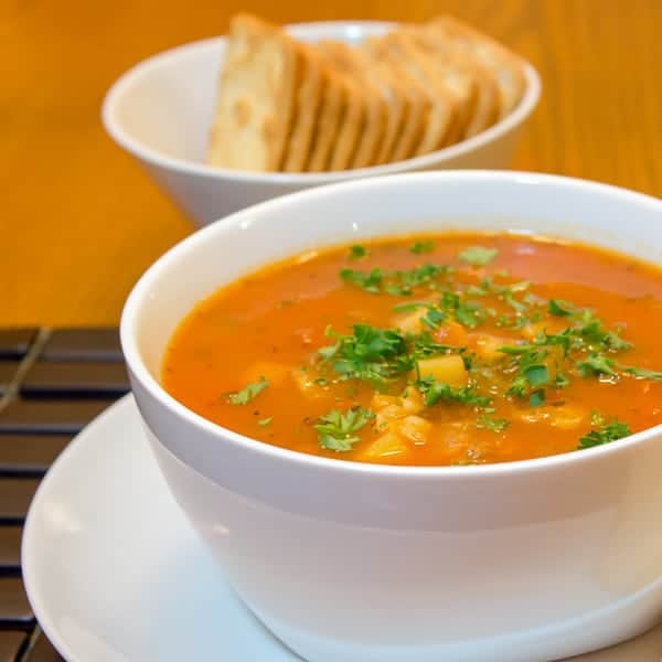 This Manhattan version of clam chowder soup recipe has a tomato broth with potatoes, celery and onions. You can use fresh, canned or frozen clams. The soup is easy to make and it tastes delicious!