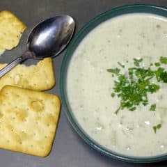 This New England Clam Chowder is rich and creamy. There are lots of minced clams and cubed potatoes in this hearty soup and the heavy cream make the broth silky smooth.