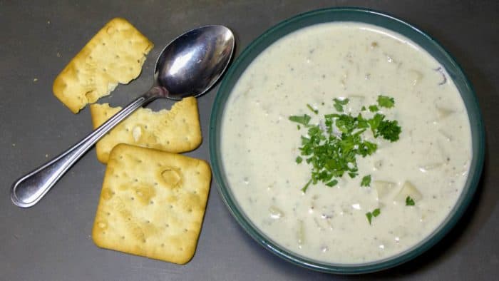 This New England Clam Chowder is rich and creamy. There are lots of minced clams and cubed potatoes in this hearty soup and the heavy cream make the broth silky smooth.