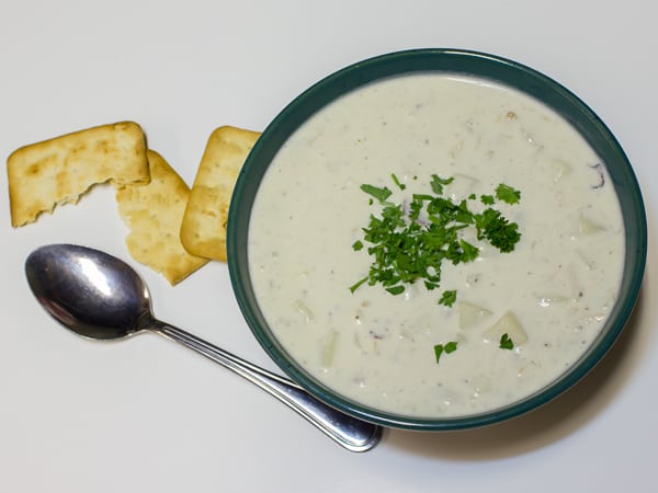 This New England Clam Chowder is rich and creamy. There are lots of minced clams and cubed potatoes in this hearty soup and the heavy cream make the broth silky smooth.