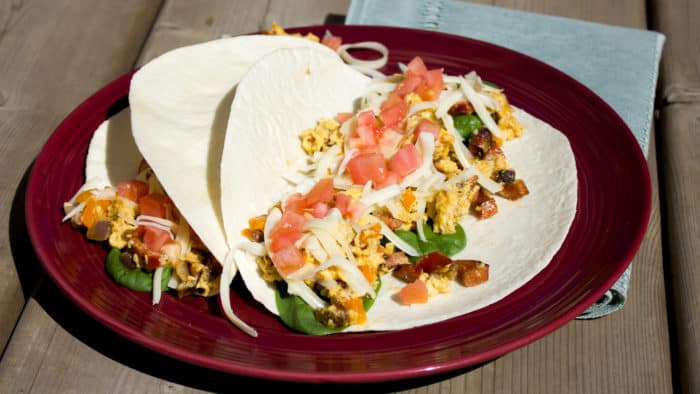 Chorizo breakfast taco recipe made with Spanish chorizo, scrambled eggs with monterey jack cheese, tomatoes and spinach.