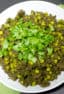 Minced beef and peas in an Indian curry sauce with fresh cilantro. Garam masala, cardamom pods, cumin, chilies, ginger and garlic make up this curry paste.