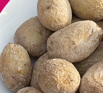 Overhead picture of salted potatoes in a bowl