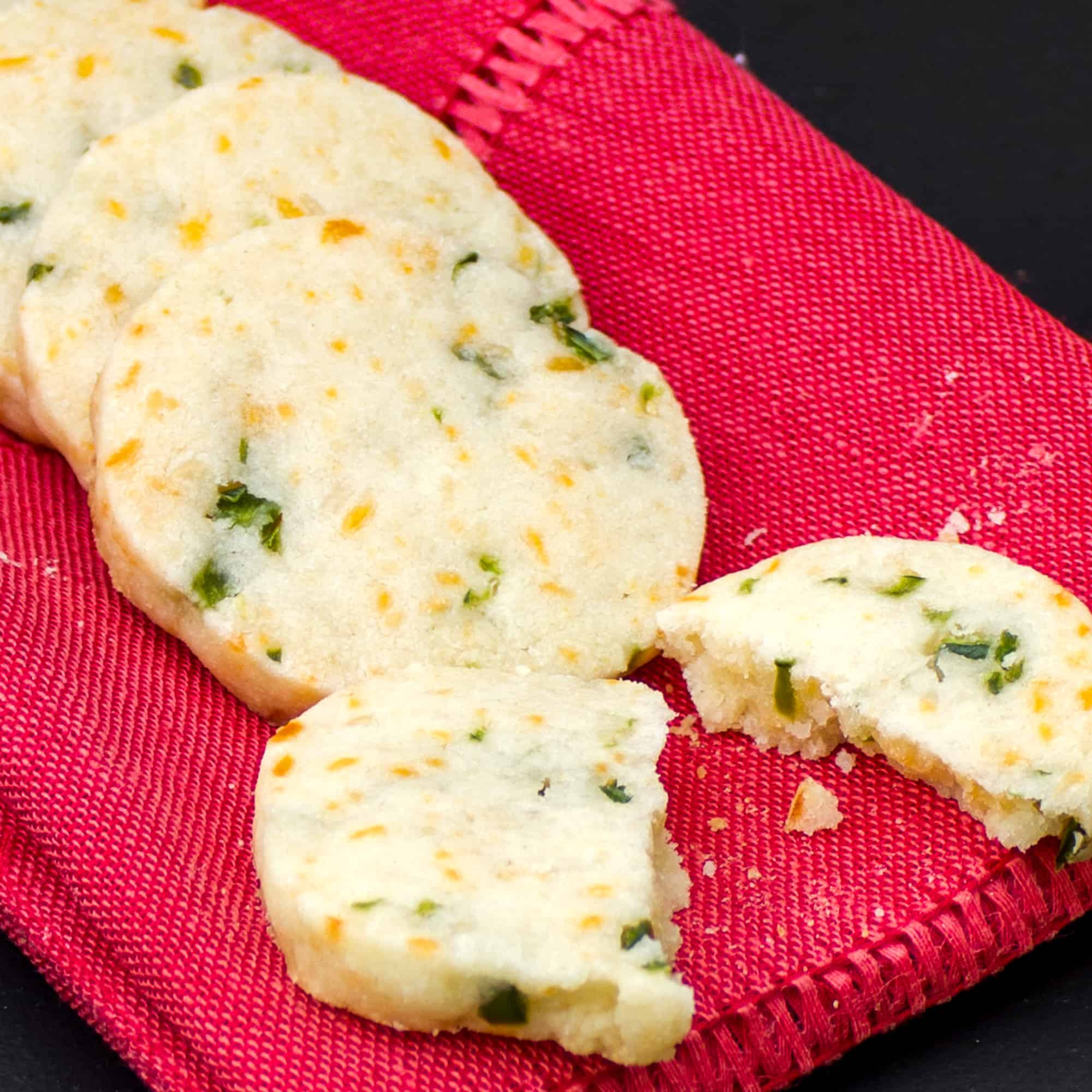 Minced jalapeno pepper and grated cheddar cheese are mixed with shortbread cookie dough to create this savory cookie recipe. These icebox cookies are chilled, cut and then baked.
