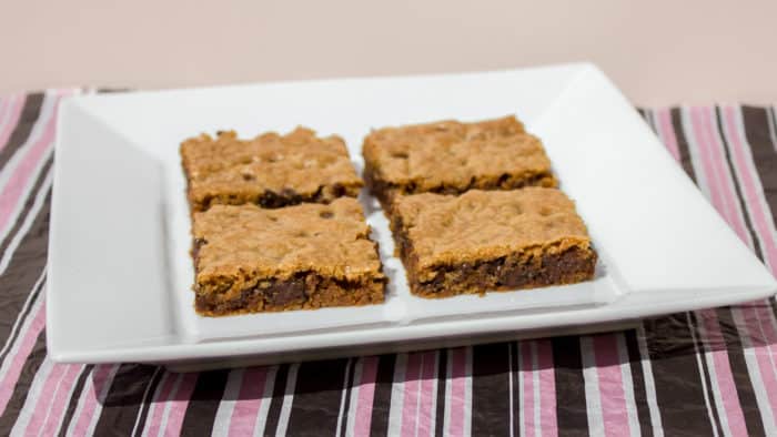 Classic chocolate chip recipe with Skor butter crunch toffee pressed on a sheet, baked and cut into bars. These cookie squares go great with coffee or milk.