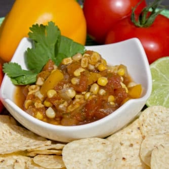 A fresh salsa with tomatoes, corn, onions, sweet peppers, jalapeno peppers, cumin and cilantro. A great Mexican appetizer to go with nacho tortilla chips.