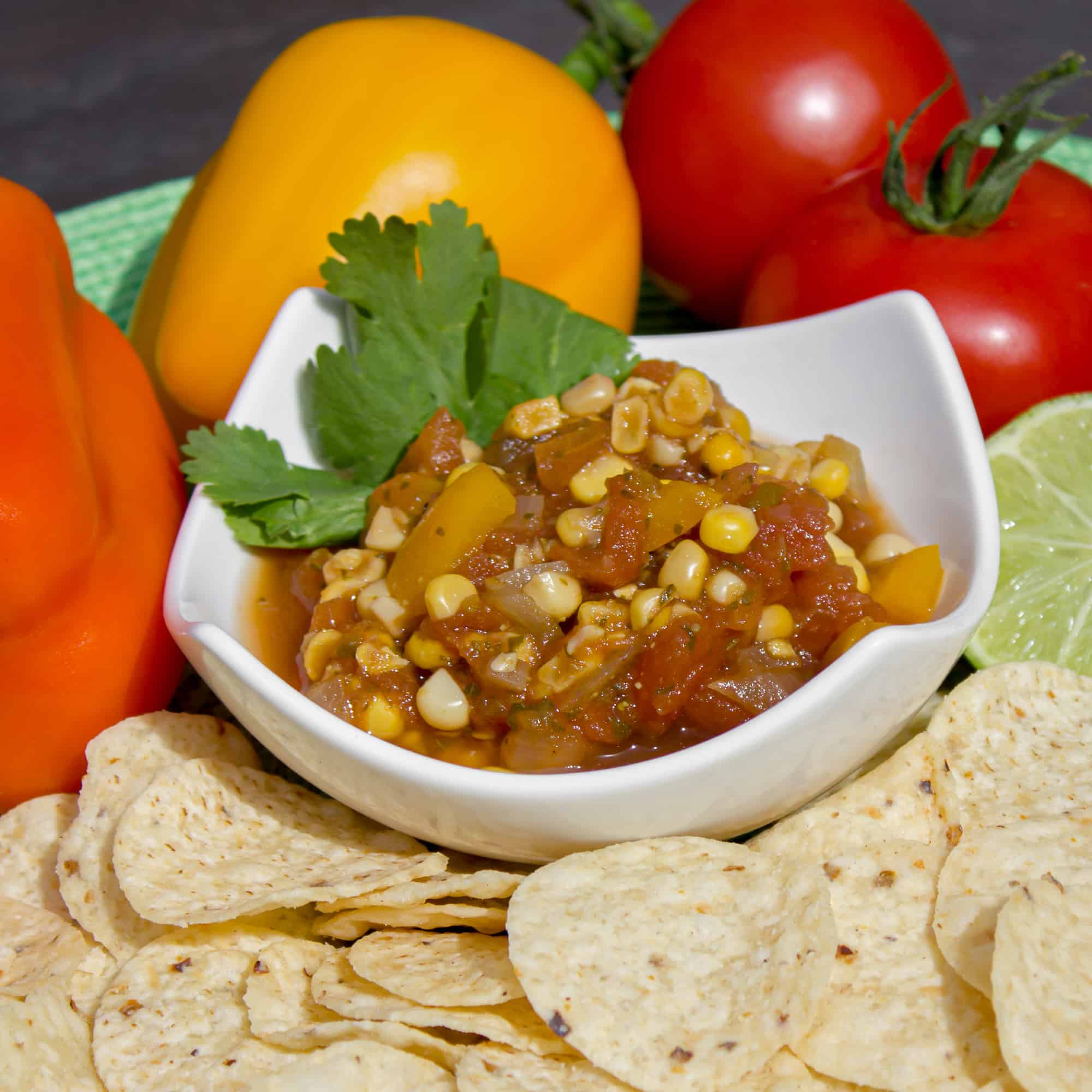A fresh salsa with tomatoes, corn, onions, sweet peppers, jalapeno peppers, cumin and cilantro. A great Mexican appetizer to go with nacho tortilla chips.