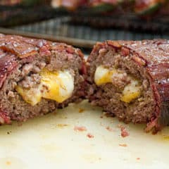 This recipe uses ground beef stuffed with cheddar cheese and shaped into a log. The beef is then wrapped by a bacon weave and smoked until cooked and gooey! Great tailgate food!