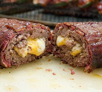 This recipe uses ground beef stuffed with cheddar cheese and shaped into a log. The beef is then wrapped by a bacon weave and smoked until cooked and gooey! Great tailgate food!