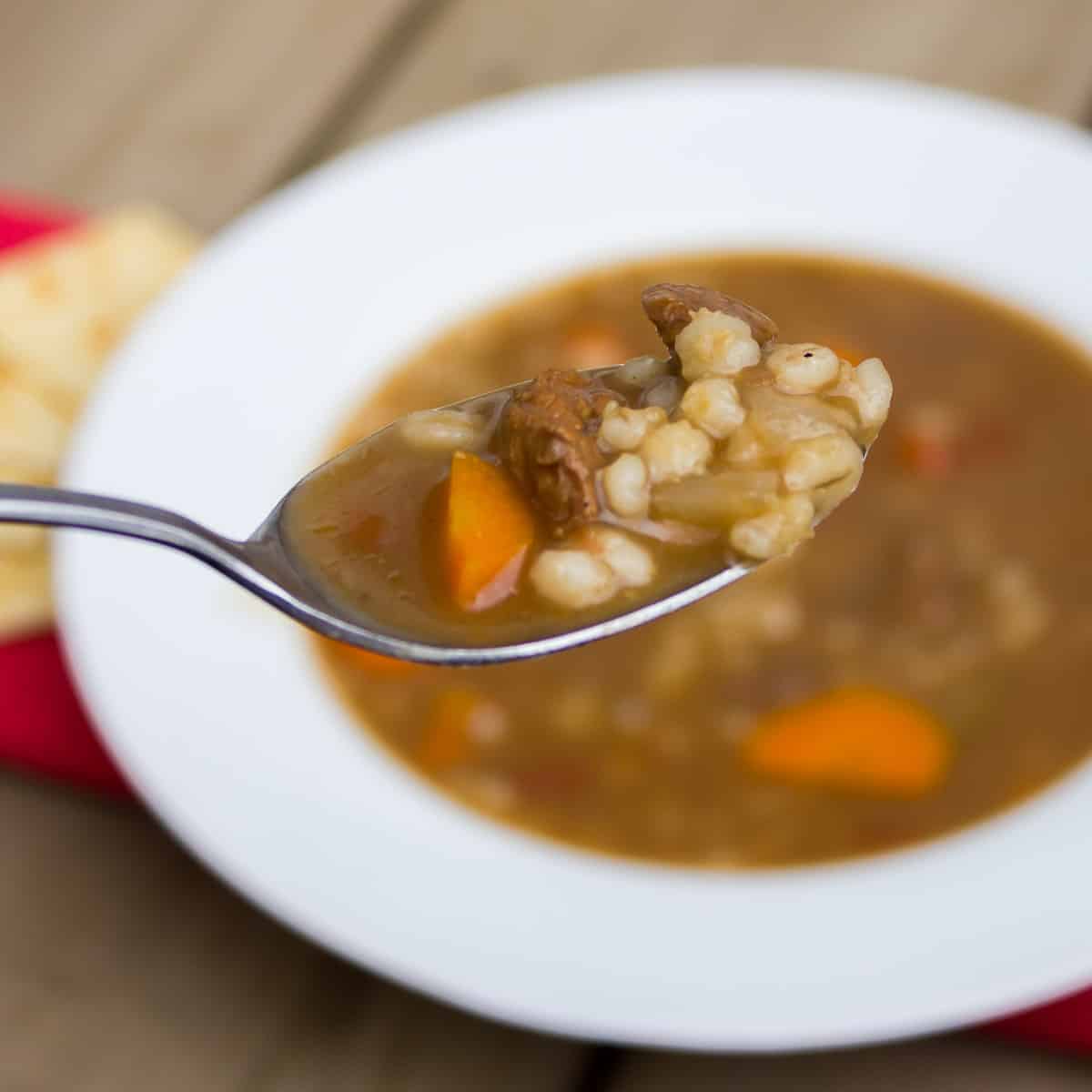 A spoonful of hearty soup that is perfect for a cold winter day.