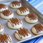 A recipe for a shortbread thumbprint cookie filled with dulce de leche and drizzled with melted chocolate. Tastes similar to a Twix candy bar with the caramel and chocolate.
