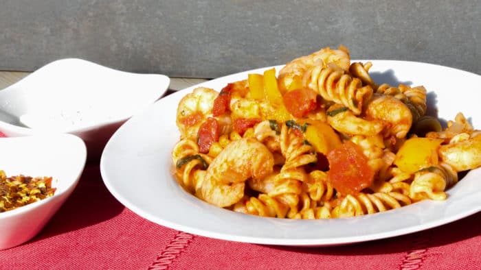 Shrimp pomodoro with rotini pasta. Easy Italian tomato based marinara sauce with white wine, peppers, onions, celery and garlic with tender shrimp as the seafood.